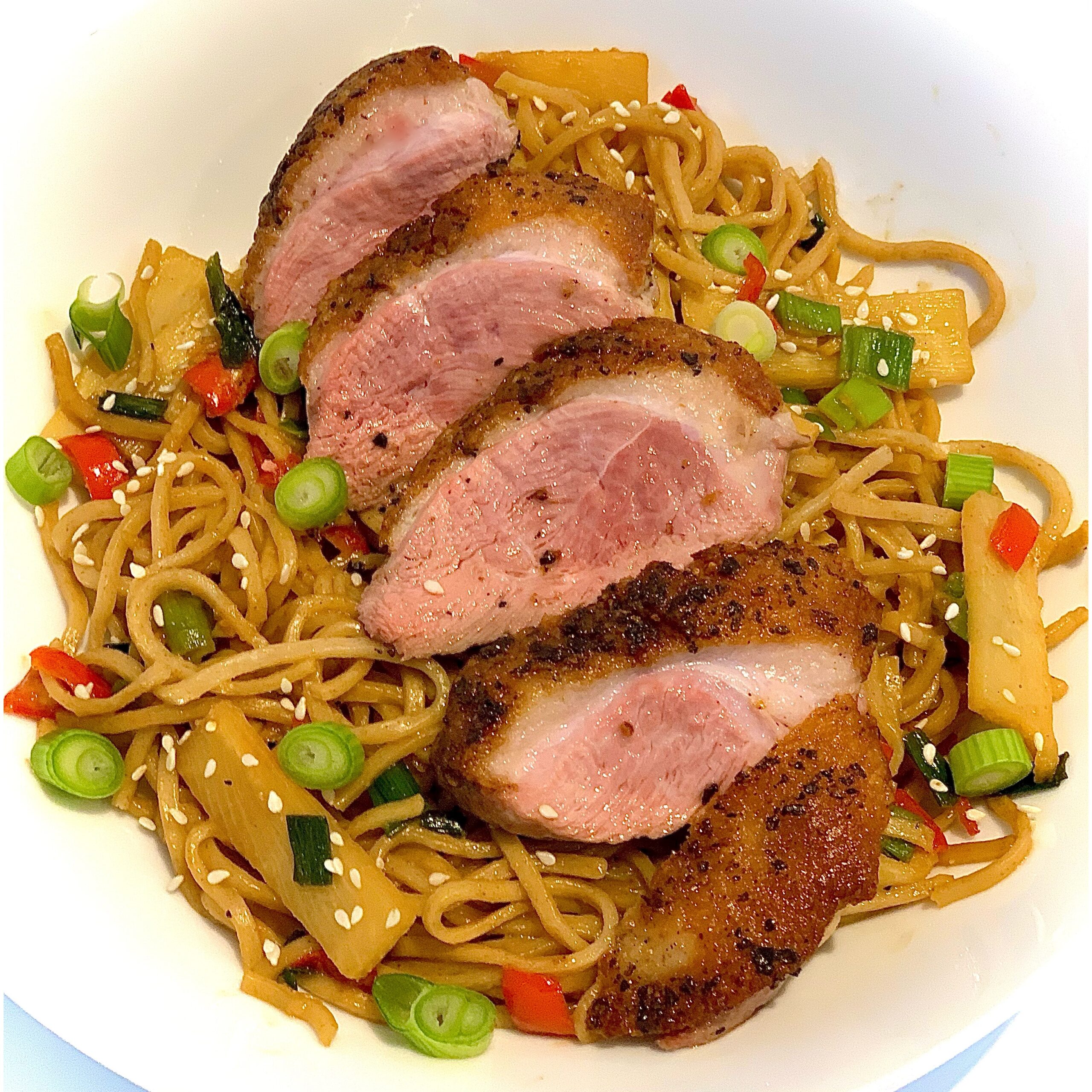 Duck breast served with Chinese wholewheat noodles